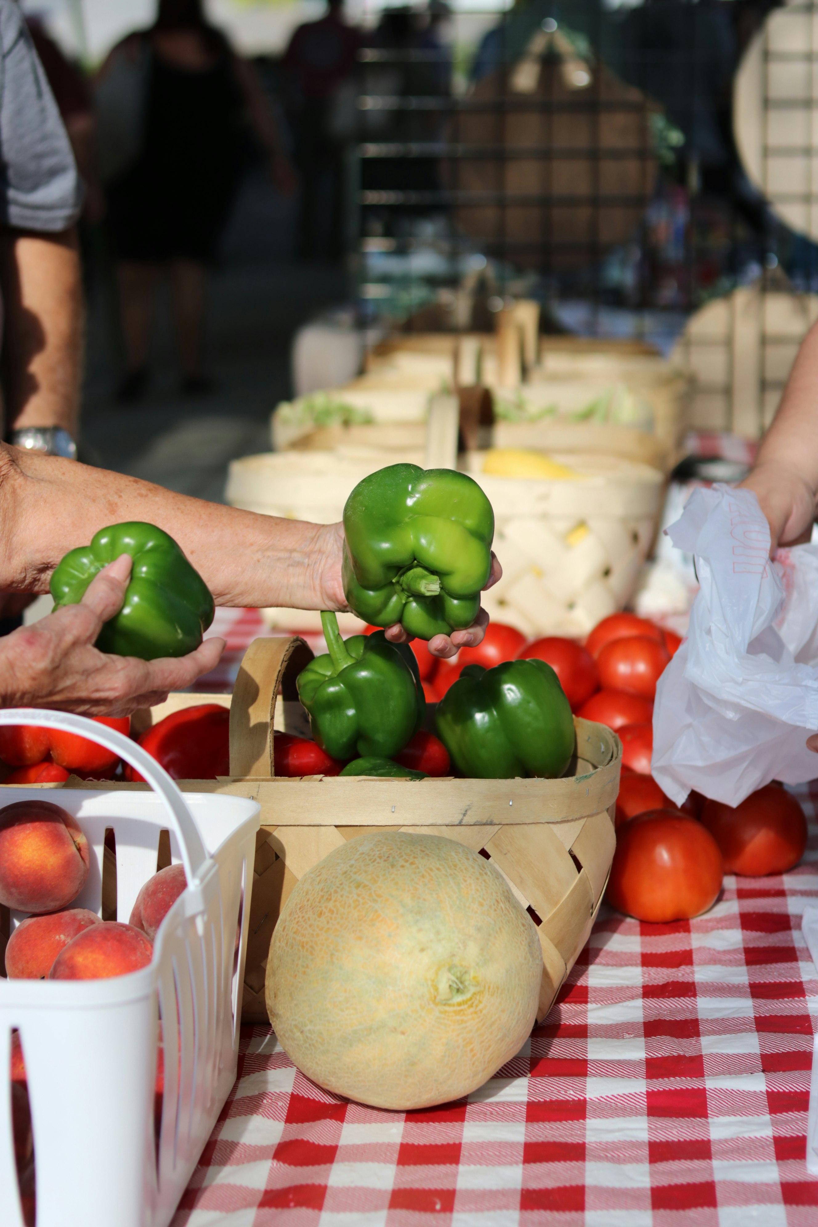 green and red bell peppers on brown cardboard box